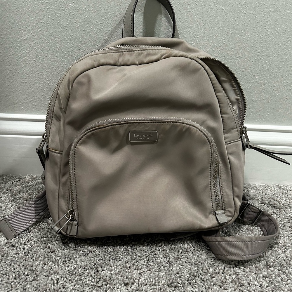 Kate Spade Gray Backpack with Adjustable Straps and Compact Design